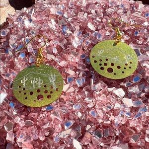 Hand engraved brass mountains and desert